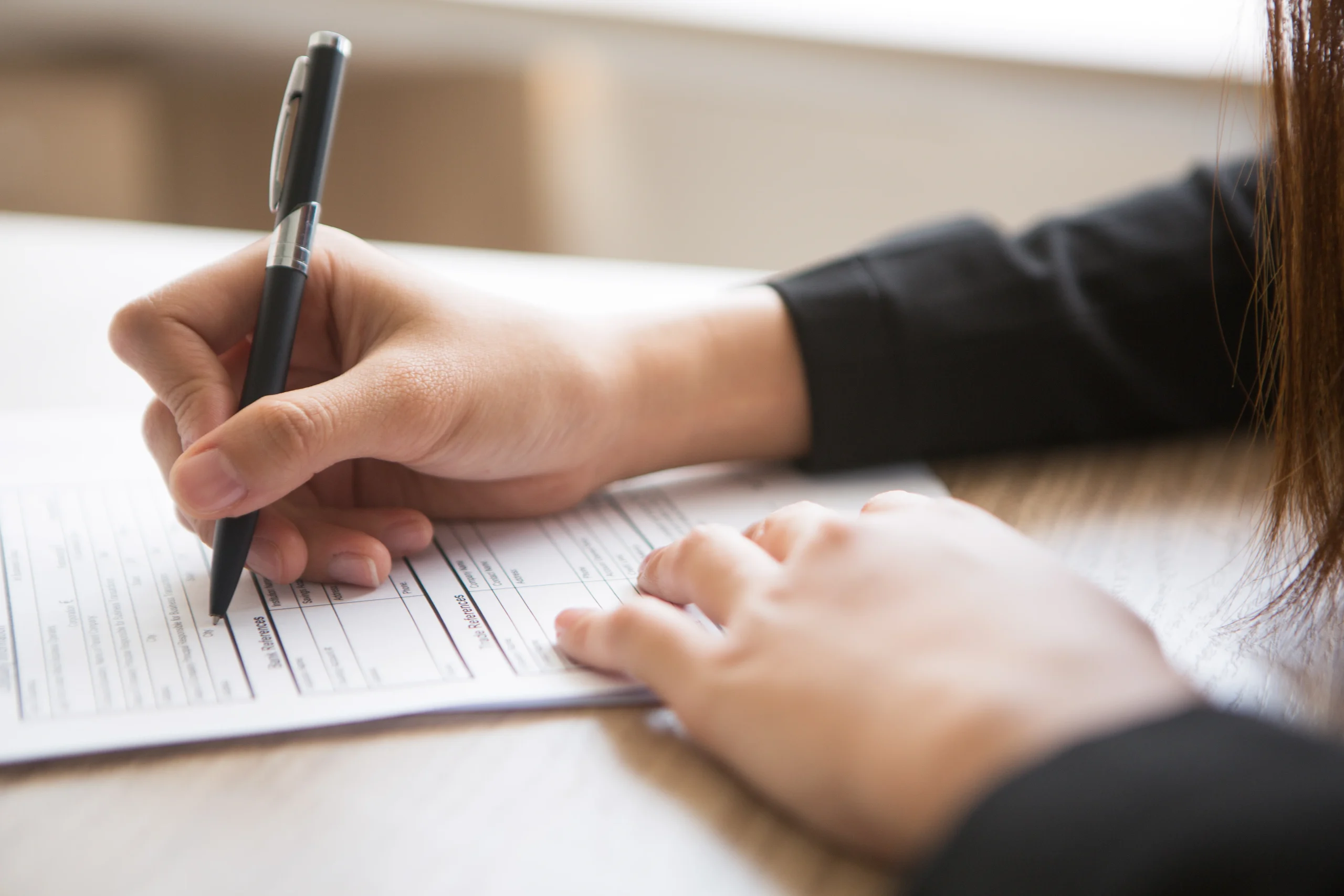 cropped-view-woman-filling-application-form